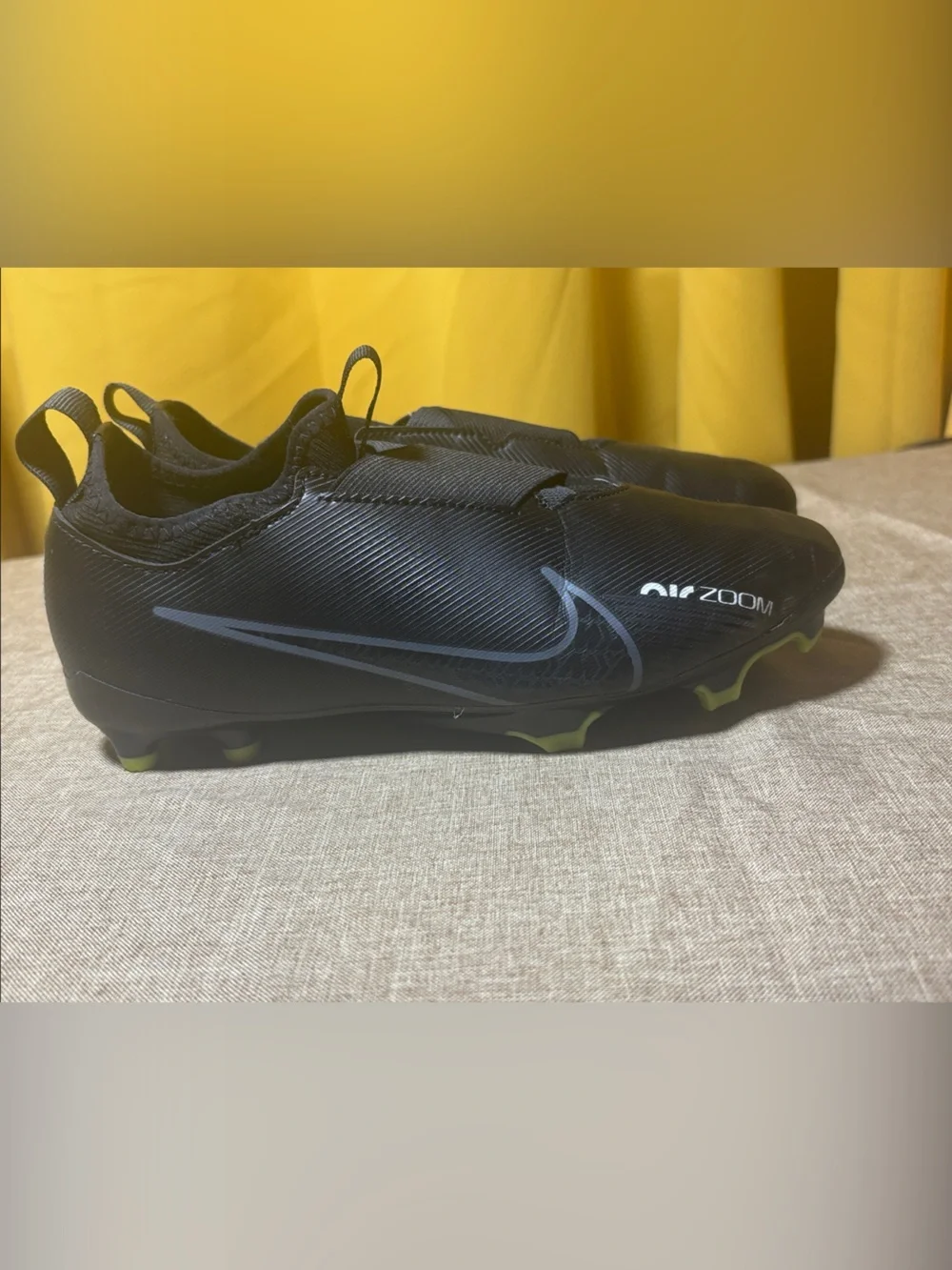 Kid’s Black Athletic Slip-On Cleats with Neon Green Lining